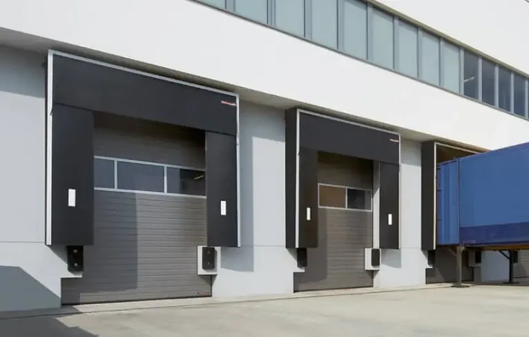 Loading bays with dock levellers, dock shelters and sectional doors